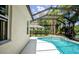 Screened in pool with lush tropical landscaping at 13811 Waterthrush Pl, Lakewood Ranch, FL 34202