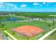 Well-maintained baseball field with bleachers at 10279 Morning Mist Ln, Sarasota, FL 34241