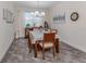Formal dining room featuring a wood table and neutral color palette at 8624 Rain Song Rd, Sarasota, FL 34238