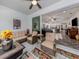 Screened porch with view of kitchen and Gathering room at 8624 Rain Song Rd, Sarasota, FL 34238