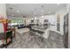 Open concept kitchen with island, stainless steel appliances, and granite countertops at 8624 Rain Song Rd, Sarasota, FL 34238