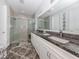 Elegant bathroom with granite countertops and large shower at 8624 Rain Song Rd, Sarasota, FL 34238