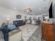 Spacious living room with dark leather sofas and open floor plan at 8624 Rain Song Rd, Sarasota, FL 34238