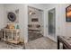 Open entryway with decorative console table and view of the office at 8624 Rain Song Rd, Sarasota, FL 34238