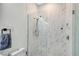 Clean bathroom with a walk-in shower and marble tile at 4715 Trento Pl, Bradenton, FL 34211