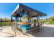 Outdoor Tiki Bar with seating, perfect for relaxing and socializing at 4726 Sand Trap Street E Cir, Bradenton, FL 34203
