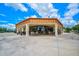 Community clubhouse with outdoor seating and large windows at 4726 Sand Trap Street E Cir, Bradenton, FL 34203