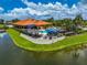 Aerial view of community clubhouse with pool and patio at 4726 Sand Trap Street E Cir, Bradenton, FL 34203