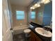 Clean bathroom with granite vanity and bathtub at 5009 Sturbridge Ct, Sarasota, FL 34238