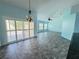 Bright dining room with light blue walls and sliding doors at 5009 Sturbridge Ct, Sarasota, FL 34238