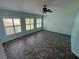 Bright bedroom with tile flooring and large windows offering natural light at 5009 Sturbridge Ct, Sarasota, FL 34238