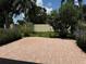 Landscaped backyard with brick patio at 5009 Sturbridge Ct, Sarasota, FL 34238