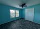 Spacious bedroom with ceiling fan and double closet at 5009 Sturbridge Ct, Sarasota, FL 34238