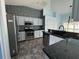 Kitchen with stainless steel appliances and dark granite countertops at 5009 Sturbridge Ct, Sarasota, FL 34238
