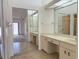 Bathroom with a double vanity, mirrored closet doors and a large walk-in shower at 5524 37Th E St # 0, Bradenton, FL 34203