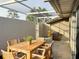 Private patio with wooden table and chairs, perfect for outdoor dining at 5524 37Th E St # 0, Bradenton, FL 34203