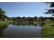 Serene lake view of a community with lush greenery at 5524 37Th E St # 0, Bradenton, FL 34203