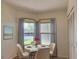 Charming dining area with a round table and four chairs, and a view of the backyard at 5524 37Th E St # 0, Bradenton, FL 34203