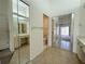 Second bathroom with double sinks, mirrored closets, and toilet at 5524 37Th E St # 0, Bradenton, FL 34203