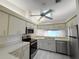 Bright kitchen featuring stainless steel appliances and light wood-look flooring at 5524 37Th E St # 0, Bradenton, FL 34203