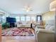 Relaxing living room featuring two recliners, a sofa, and a TV at 3333 26Th E Ave # 1099, Bradenton, FL 34208