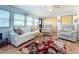 Bright living room with comfy seating, a large TV, and a beautiful area rug at 3333 26Th E Ave # 1099, Bradenton, FL 34208