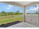 Beautiful backyard view with a pond and nature from the covered lanai with an open-air design at 305 Potenza Loop, Nokomis, FL 34275