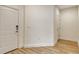 Bright entryway shows the front door and the door to another room at 305 Potenza Loop, Nokomis, FL 34275