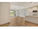 Bright, open kitchen with stainless appliances and seamless access to outdoor patio at 305 Potenza Loop, Nokomis, FL 34275