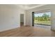 Neutral living area with recessed lighting and sliding glass doors to a picturesque backyard at 305 Potenza Loop, Nokomis, FL 34275
