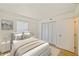 Bright bedroom boasts neutral tones, a comfortable bed, and ample natural light from the window at 6304 Pointe West Blvd # A102, Bradenton, FL 34209