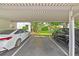 Designated carport parking featuring two vehicles in a covered parking space at 6304 Pointe West Blvd # A102, Bradenton, FL 34209