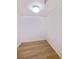 Walk-in closet featuring wood-look floors and a sprinkler system at 6304 Pointe West Blvd # A102, Bradenton, FL 34209
