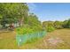 Exterior shot of a community garden area surrounded by trees and green foliage at 6304 Pointe West Blvd # A102, Bradenton, FL 34209