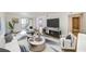 Bright living room featuring modern furniture, stylish rug, and sliding doors to the balcony at 6304 Pointe West Blvd # A102, Bradenton, FL 34209