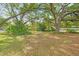 Park featuring lush greenery, mature trees, and a bench for relaxing under the shade at 6304 Pointe West Blvd # A102, Bradenton, FL 34209