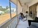 Spacious screened lanai with seating area and view of the community at 6582 Fairway Gardens Dr # 6582, Bradenton, FL 34203