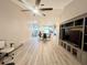 Living room with hardwood floors and view of dining area at 6582 Fairway Gardens Dr # 6582, Bradenton, FL 34203