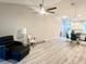 Spacious living room featuring hardwood floors and lots of natural light at 6582 Fairway Gardens Dr # 6582, Bradenton, FL 34203
