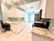 Bright kitchen with granite countertops, stainless steel appliances, and ample cabinetry at 6582 Fairway Gardens Dr # 6582, Bradenton, FL 34203