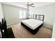 Well-lit bedroom with a queen bed and neutral decor at 6582 Fairway Gardens Dr # 6582, Bradenton, FL 34203