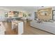 Modern kitchen with white cabinets, large island, and high-end appliances at 111 Gull Dr, Anna Maria, FL 34216