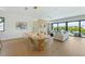 Bright dining area with a large oval table and modern chairs at 111 Gull Dr, Anna Maria, FL 34216