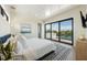 Serene bedroom with water views and private balcony access at 111 Gull Dr, Anna Maria, FL 34216