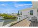 Private balcony overlooking the water and neighboring houses at 111 Gull Dr, Anna Maria, FL 34216