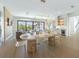 Modern dining area with oval table and clear acrylic chairs at 111 Gull Dr, Anna Maria, FL 34216