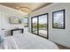 Bedroom with water views and sliding glass doors to deck at 111 Gull Dr, Anna Maria, FL 34216