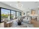 Open living space featuring a comfy sofa and water views at 111 Gull Dr, Anna Maria, FL 34216