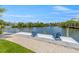 Private dock with two chairs overlooking the peaceful waterway at 111 Gull Dr, Anna Maria, FL 34216