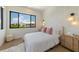 Cozy bedroom with a queen bed and stylish decor at 111 Gull Dr, Anna Maria, FL 34216